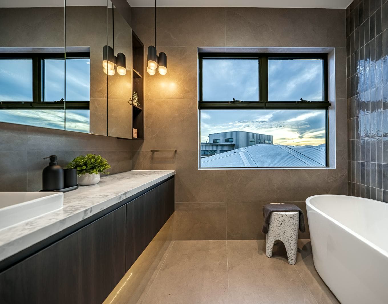 Completed bathroom with twin basins and custom vanity cabinetry