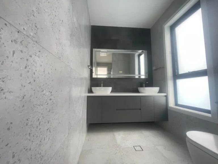 Bathroom with twin basins and custom vanity cabinetry